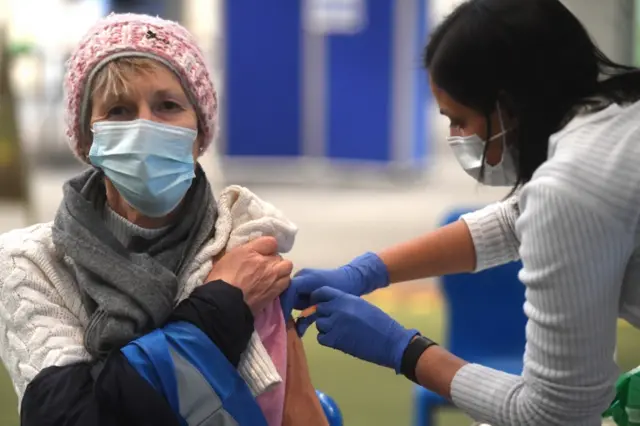 Woman receives a jab