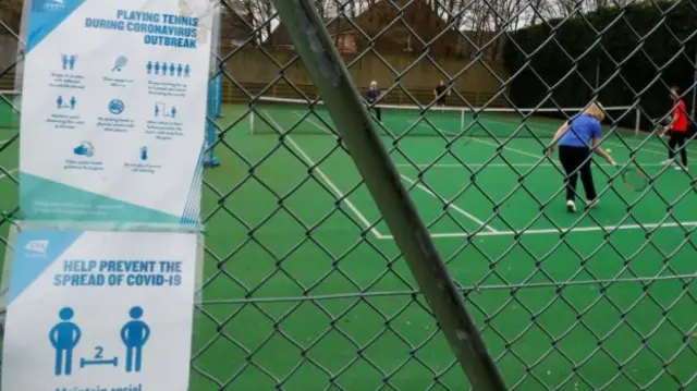 Tennis match and Covid signs