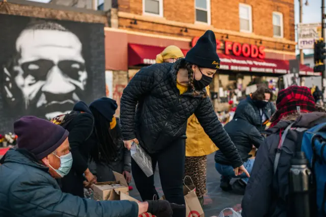 Demonstrators organize candles ahead of a candlelight vigil on March 28, 2021 in Minneapolis, Minnesota. Community members continue demonstrations ahead of opening statements in the trial of former Minneapolis police officer Derek Chauvin, who faces murder charges in the death of George Floyd