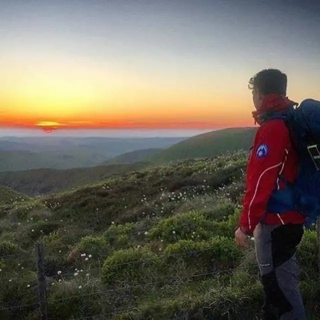 MRT member looks at sunset over national park