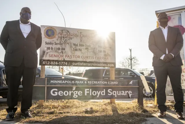 Rodney Floyd (L), brother of George Floyd, and Brandon Williams (R), nephew of George Floyd, pose for a photo at George Floyd Square