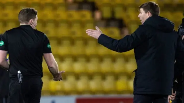Referee John Beaton and Rangers manager Steven Gerrard
