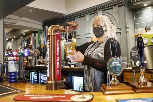 Pulling a pint at the Black Bull pub in Haworth, West Yorkshir