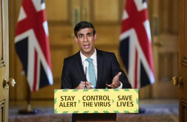 The chancellor at a press confernence in Downing Street last year