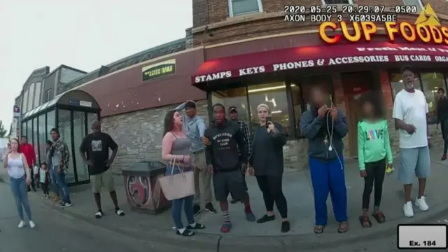 Bystanders watch George Floyd be detained by police