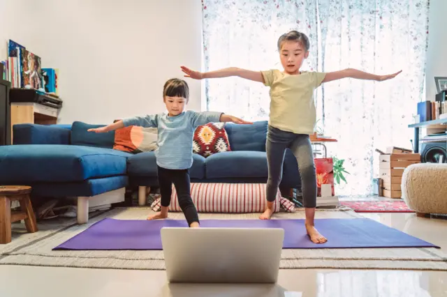 Stock image of kids exercising in lockdown