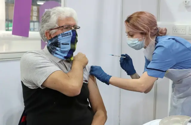 nurse gives vaccine