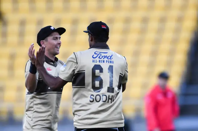 Trent Boult and Ish Sohdi celebrate