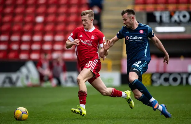 Hamilton's Scott McMann (right) challenges with Ross McCrorie (left)