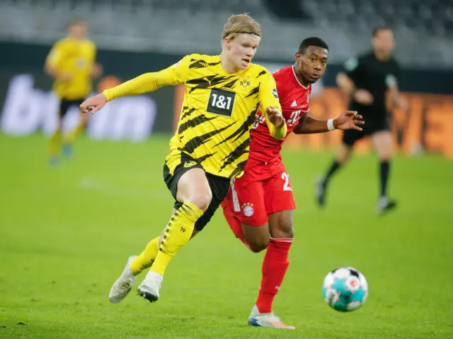 Borussia Dortmund's Erling Braut Haaland up against Bayern's David Alaba