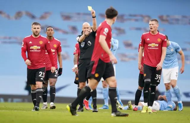 Harry Maguire shown yellow card