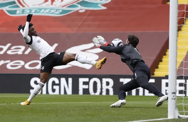 Alisson blocks Josh Maja's attempt