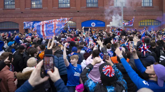 Rangers fans gather outside of Ibrox