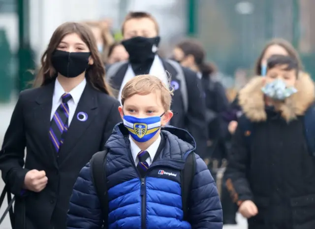 Boy with a Leeds United face mask returns to school at Outwood Academy in Doncaster