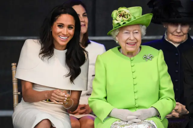 Queen Elizabeth II sits with Meghan, Duchess of Sussex during a ceremony to open the new Mersey Gateway Bridge on June 14, 2018 in the town of Widnes in Halton, Cheshire, England