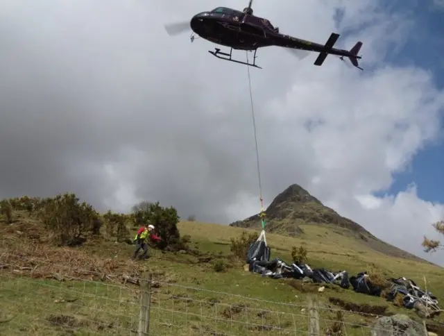 Supplies for path repairs arrive by helicopter