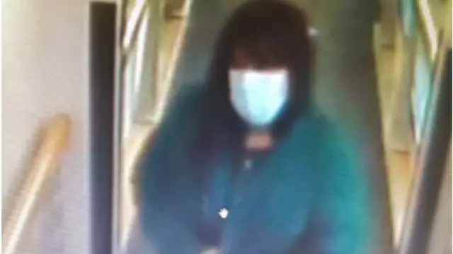 CCTV image of woman