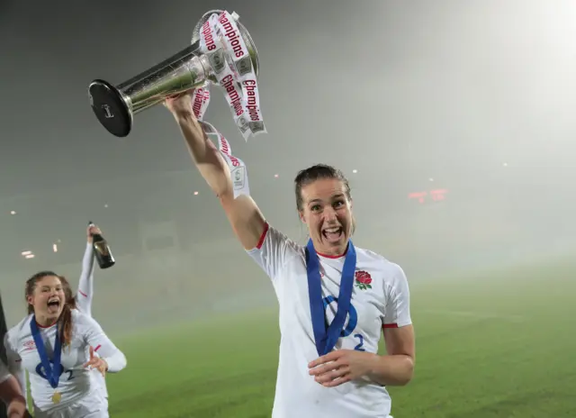 Emily Scarratt celebrates with the 6 Nations trophy