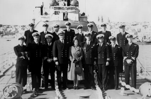 The Duke of Edinburgh and the Queen pose for a photograph on HMS Chequers in Malta, in December 949