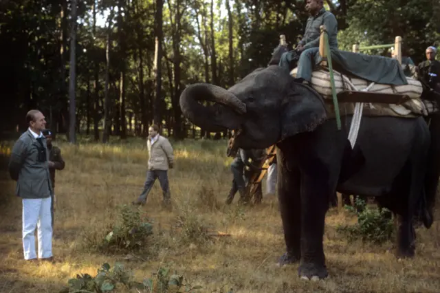 The Duke of Edinburgh with driver Vandevi and his female Elephant Mamhout Mahavir during a trip to the Kanha Game Reserve