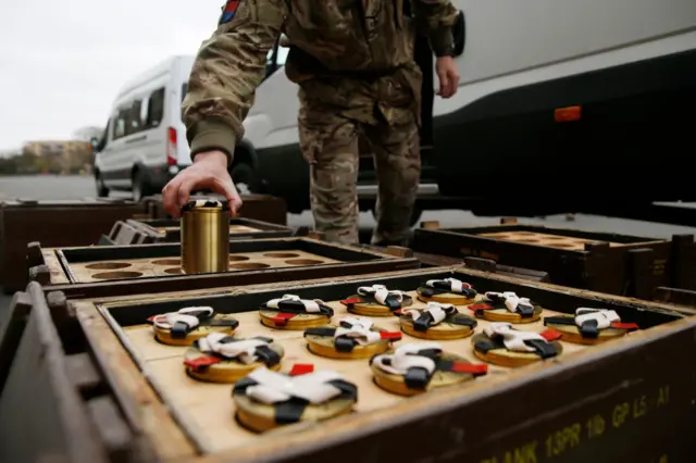 The Kings Troop, Royal Horse Artillery, prepare shells for firing