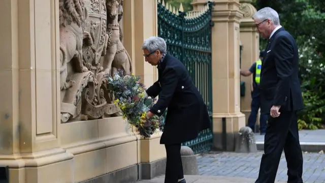 Victorian Governor Linda Dessau (L) and Anthony Howard AM QC lay a wreath at the gates of Government House following the death of Prince Philip, Duke of Edinburgh, in Melbourne, Australia,