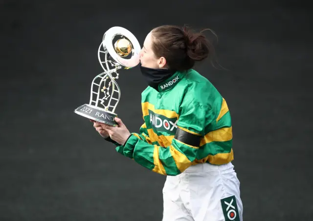 Blackmore receives the winner's trophy