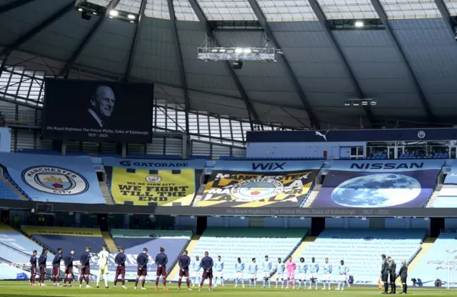 Players and officials take part in a minute's silence before the Manchester City v Leeds United match at the Etihad Stadium in Manchester