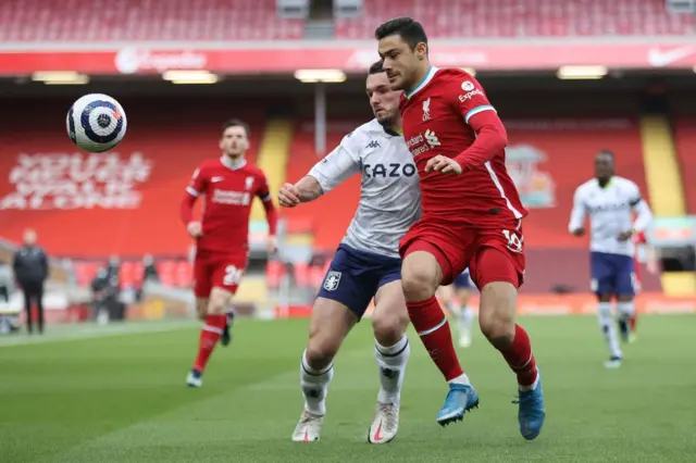 Aston Villa's John McGinn and Liverpool's Ozan Kabak