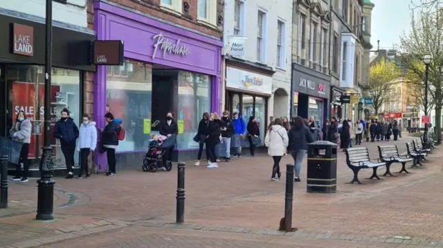 Shoppers queuing in Carlisle