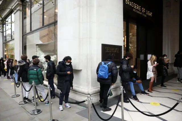 Shoppers queuing outside Selfridges in central London