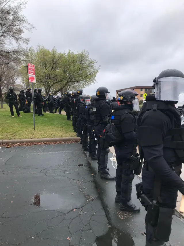 Police facing protesters in Brooklyn Center