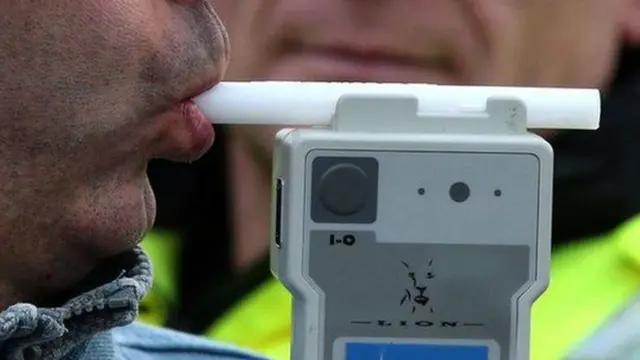 Man using a breathalyser