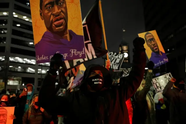 Activists march through downtown on the tenth day in the trial of former police officer Derek Chauvin