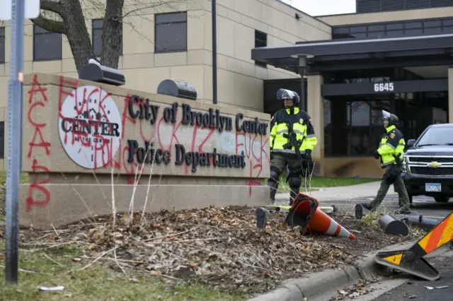 Police stand outside the Brooklyn Center Police Department