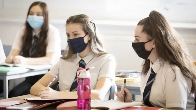 Pupils wearing face coverings (file photo)