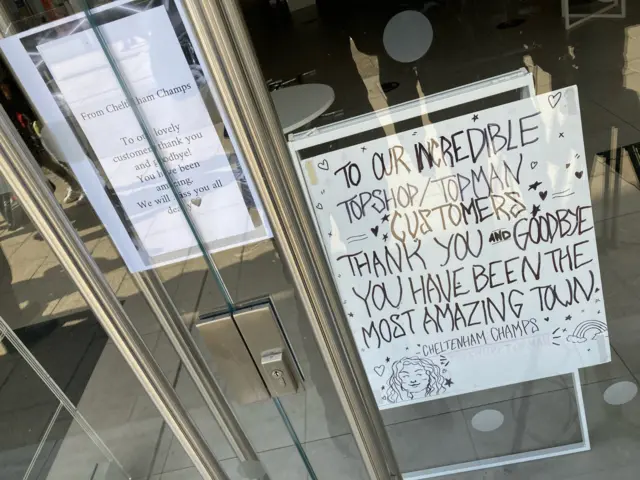 A sign in Topshop's window