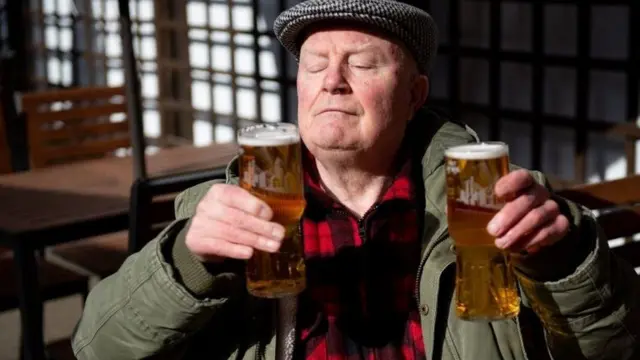 A man with two beers