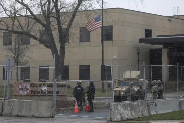 National Guard members outside a police station in Brooklyn Center