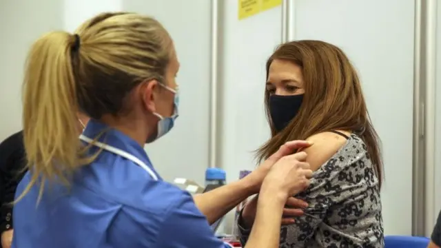 A woman getting a Covid vaccine