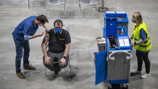 A man receives a vaccine in Prague