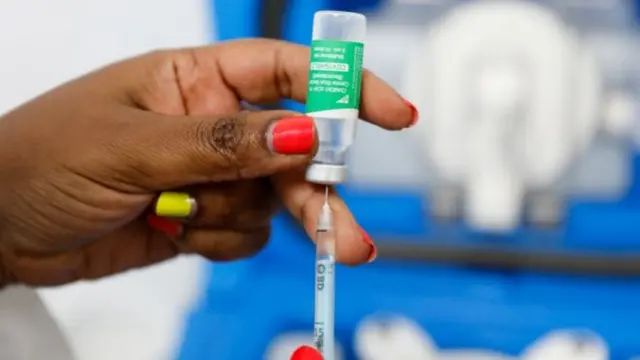 A medical worker prepares a dose of AstraZeneca at the Ruaraka Uhai Neema Hospital in Nairobi, Kenya - 8 April 2021