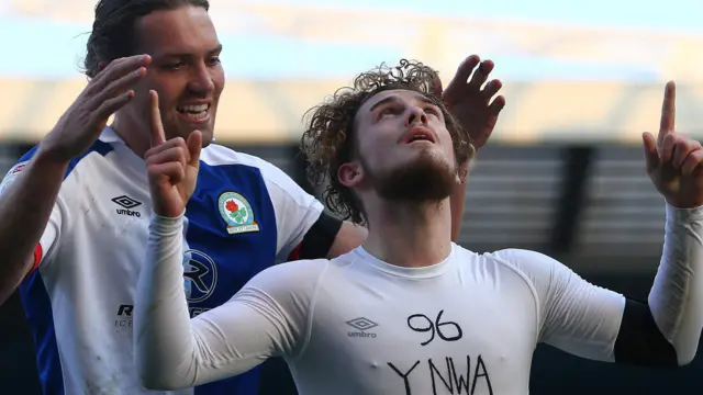 Sam Gallagher and Harvey Elliott celebrate a goal against Blackburn Rovers