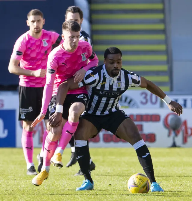 St Mirren's Jon Obika (R) holds off Inverness' Daniel MacKay