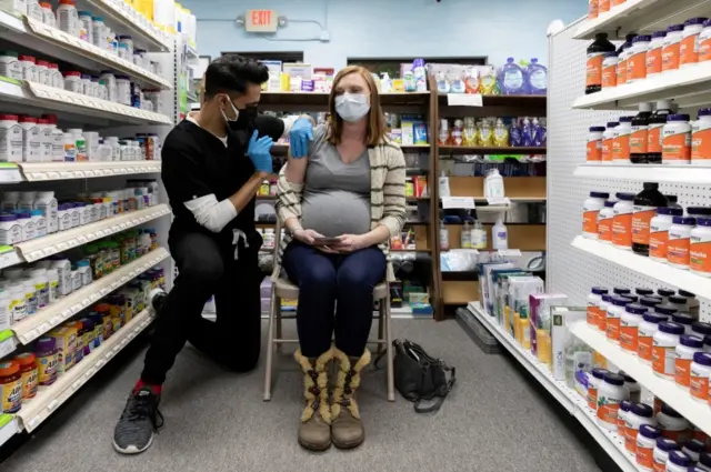 A pregnant woman is given a jab in Schwenksville, Pennsylvania, US