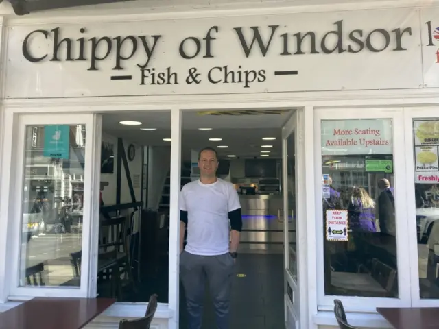 Riyadh Terha at the door of his Chippy of Windsor shop