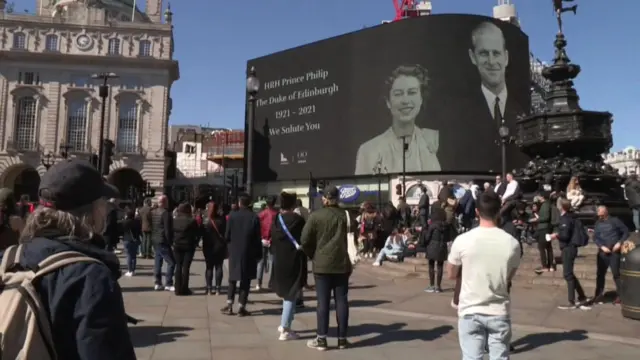 People looking at the big screen at Piccadilly Circus