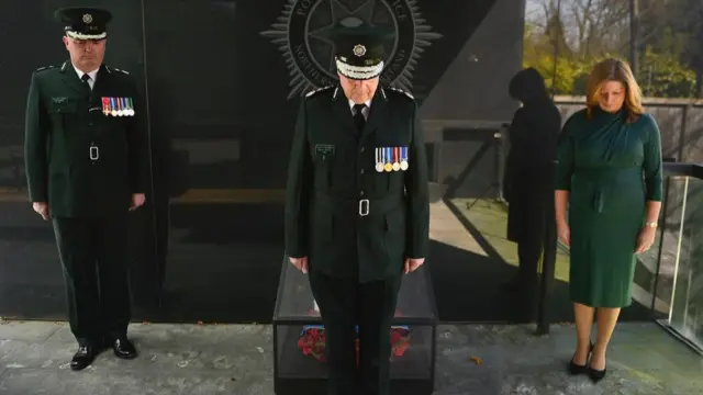 The Chief constable of the Police Service of Northern Ireland leads a minute's silence