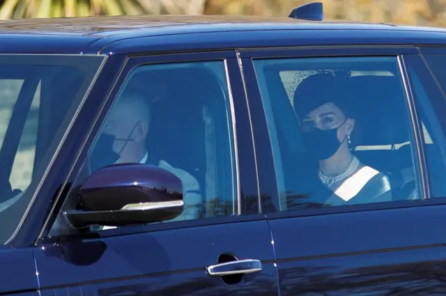 The Duchess of Cambridge seen through a car window