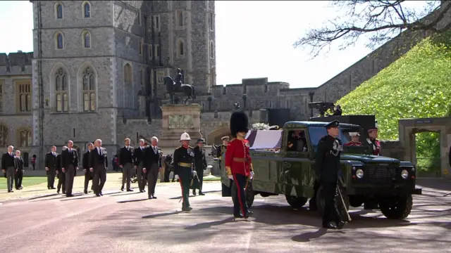 Members of the royal family walk behind the coffin